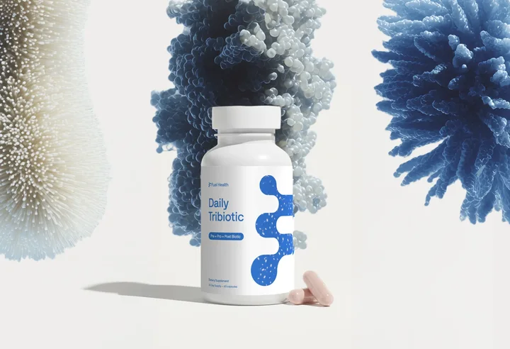 A white Fuel Health bottle and pale capsules sit beneath large blue and cream textured forms.